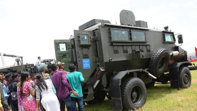 Visitors eagerly looking at the interior of an army combat truck at the 'Know Your Army' exhibition. (HT PHOTO)