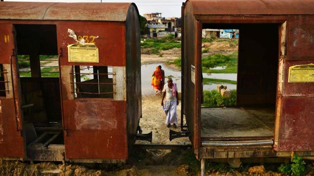 Nepali people walk past abandoned railway carriages of the Nepal Railway Corporation Ltd in Janakpur, some 300km south of Kathmandu. Three years after its last train hit the buffers, landlocked Nepal is building a new railway network to boost its ailing economy -- helped by the rivalry between its powerful neighbours, China and India. (AFP Photo) Nepali people walk past abandoned railway carriages of the Nepal Railway Corporation Ltd in Janakpur, some 300km south of Kathmandu. Three years after its last train hit the buffers, landlocked Nepal is building a new railway network to boost its ailing economy -- helped by the rivalry between its powerful neighbours, China and India. (AFP Photo)