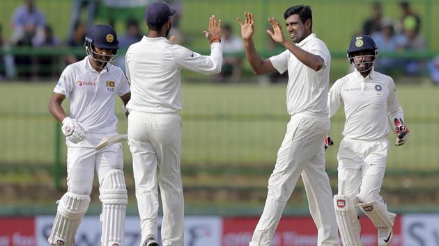 India's Ravichandran Ashwin, second right, celebrates with teammates the dismissal of Sri Lanka's captain Dinesh Chandimal. (AP)
