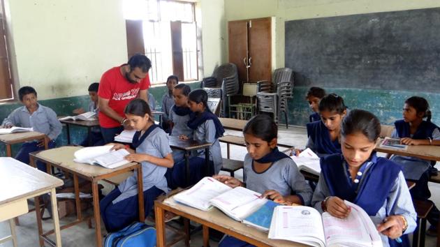 Navpreet Kumar, the teacher at the school, when told about the deputation of three teachers, was happy and relieved and said he would work even harder now.(Parampreet Singh Narula/HT)