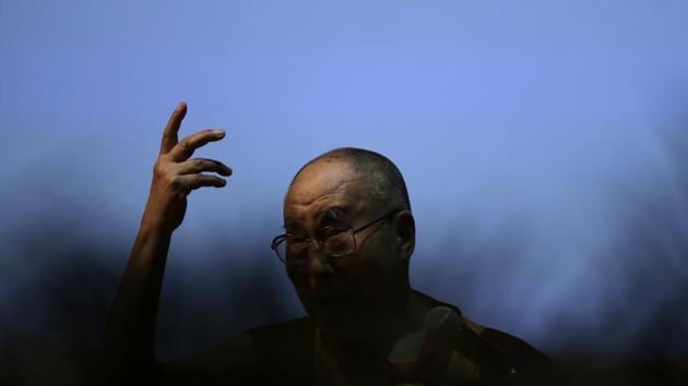 Tibetan spiritual leader the Dalai Lama gestures as he speaks on ‘the art of happiness’ at a public event in New Delhi on Thursday. (Tsering Topgyal/AP)