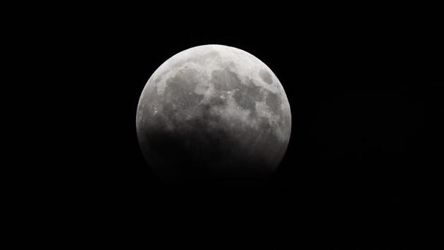 Partial lunar eclipse seen from Parel in Mumbai, India, on Tuesday, August 8. (Satyabrata Tripathy/HT Photo)