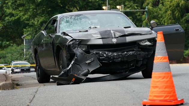 The car that allegedly plowed through a crowd of protestors marching through a downtown shopping district is seen after the vehicle was stopped by police several blocks away on Saturday in Charlottesville, Virginia. (AFP) The car that allegedly plowed through a crowd of protestors marching through a downtown shopping district is seen after the vehicle was stopped by police several blocks away on Saturday in Charlottesville, Virginia. (AFP)