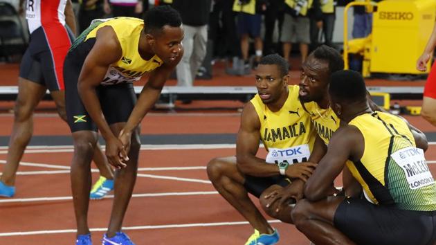 Bolt’s teammates consoled him after the race. (REUTERS)