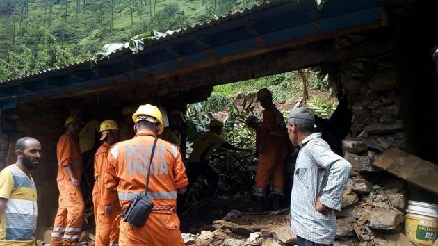 Rescue workers try to find survivors after a recent landslide in Pithoragarh district. (HT Photo) Rescue workers try to find survivors after a recent landslide in Pithoragarh district. (HT Photo)