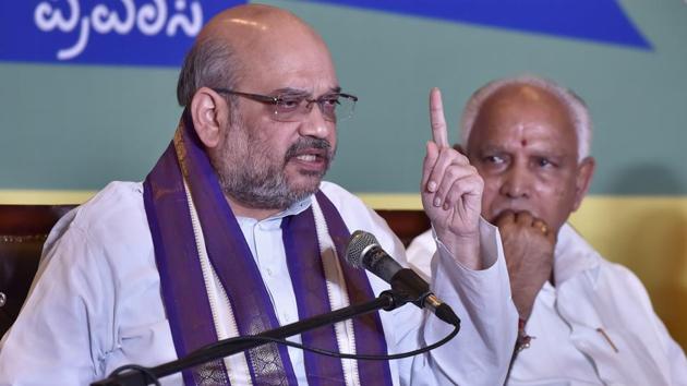 BJP president Amit Shah addresses a press conference in Bengaluru on Monday. Party’s Karnataka unit president and former state chief minister B S Yeddyurappa looks on. (Arijit Sen/HT) BJP president Amit Shah addresses a press conference in Bengaluru on Monday. Party’s Karnataka unit president and former state chief minister B S Yeddyurappa looks on. (Arijit Sen/HT)