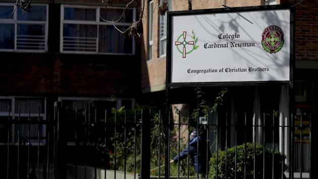 In this July 19, 2017 photo, a sign announces the Cardinal Newman school on the outskirts of Buenos Aires, Argentina. Newman was launched in Argentina in 1948 by the Christian Brothers, a religious order founded two centuries ago to focus on educating disadvantaged youth. Today the socially conservative church school is something of a refuge for children of the rich, and in recent years, it has faced abuse claims at many of the schools it has opened worldwide. (AP) In this July 19, 2017 photo, a sign announces the Cardinal Newman school on the outskirts of Buenos Aires, Argentina. Newman was launched in Argentina in 1948 by the Christian Brothers, a religious order founded two centuries ago to focus on educating disadvantaged youth. Today the socially conservative church school is something of a refuge for children of the rich, and in recent years, it has faced abuse claims at many of the schools it has opened worldwide. (AP)