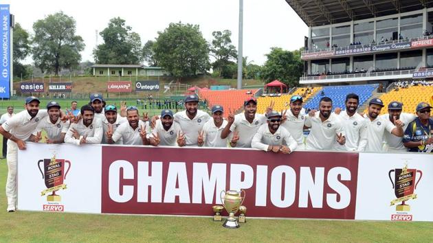Indian cricketers pose for photographers after victory on the third day of the third and final Test match against Sri Lanka at the Pallekele International Cricket Stadium on Monday.(AFP)