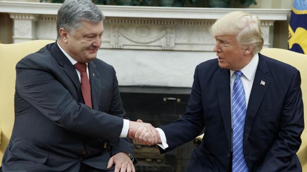 In this June 20, 2017, file photo, President Donald Trump shakes hands with Ukrainian President Petro Poroshenko during a meeting in the Oval Office of the White House in Washington.(AP)