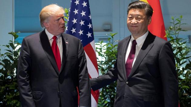 US President Donald Trump and Chinese President Xi Jinping meet on the sidelines of the G20 Summit in Hamburg, Germany, in July.(Reuters Photo)