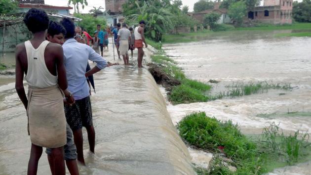 Flood waters have engulfed areas in Kisanganj, three blocks of Purnea and one block of Katihar damaging roads. (PTI)