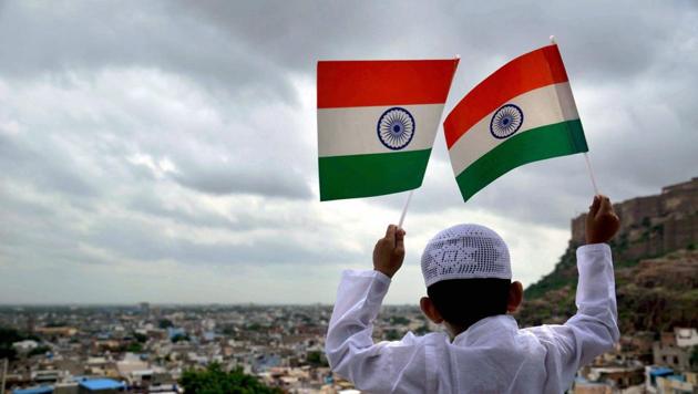 A boy waves the Indian tri-colour at Mehrangarh Fort road on the eve of Independence Day in Jodhpur, Rajasthan, on Monday.(PTI) A boy waves the Indian tri-colour at Mehrangarh Fort road on the eve of Independence Day in Jodhpur, Rajasthan, on Monday.(PTI)