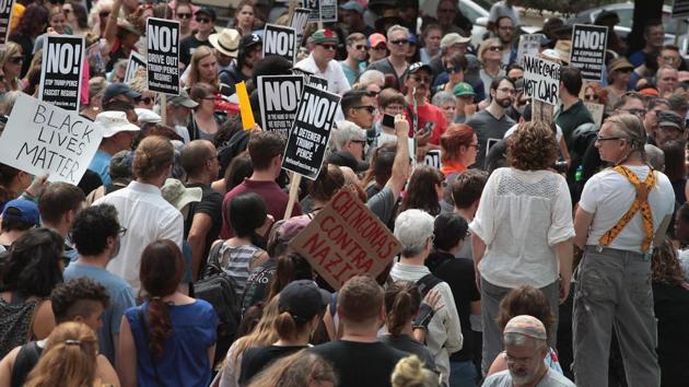 People gather in Millennium Park to protest the alt-right movement and to mourn the victims of rally in Charlottesville, Virginia on August 13, 2017 in Chicago, Illinois.(AFP Photo) People gather in Millennium Park to protest the alt-right movement and to mourn the victims of rally in Charlottesville, Virginia on August 13, 2017 in Chicago, Illinois.(AFP Photo)