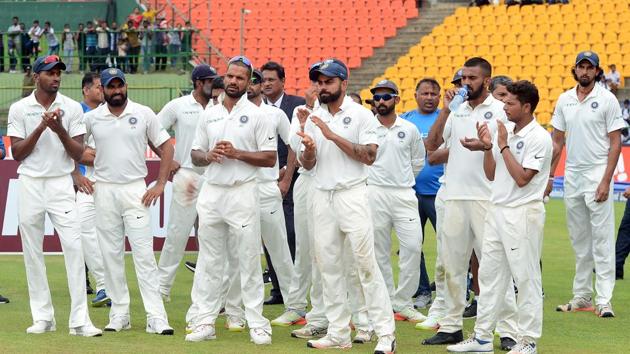 Indian cricketers react during the presentation ceremony after victory on the last day of the third and final Test against Sri Lanka at the Pallekele International Cricket Stadium. (AFP) Indian cricketers react during the presentation ceremony after victory on the last day of the third and final Test against Sri Lanka at the Pallekele International Cricket Stadium. (AFP)