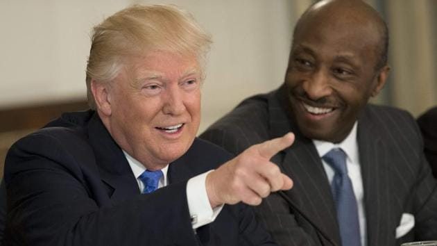 This file photo taken on February 23, 2017 shows US President Donald Trump speaking alongside Merck CEO Kenneth Frazier (R) during a meeting with manufacturing CEOs in the State Dining Room at the White House in Washington, DC.(AFP)
