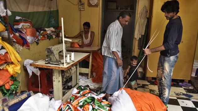 A massive 500 meter long Indian national flag is packed ahead of Independence day celebrations at a workshop in Old Delhi’s Sadar Bazar. This piece in particular is headed for the Rajouri Garden area in Delhi where it shall be hoisted on Tuesday, August 15, 2017. (Burhaan Kinu / HT Photo)