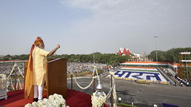 Indian Prime Minister Narendra Modi addresses while children choreograph the Hindi word ‘Bharat’ in the background. On the need for standing united, the Prime Minister said that India is about Shanti, Ekta and Sadbhavana and that casteism and communalism will not help us. Violence in the name of faith will not be tolerated in this land of Gandhi and Buddha. (Raj K Raj / HT Photo)