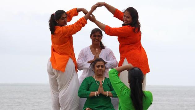 Yoga teachers pose for a picture. (Nilofer Khan/HT Photo) 