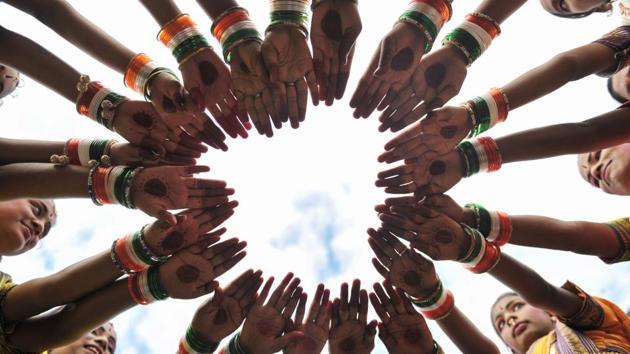 Women wear tricolour bangles before the Independence Day celebrations in Secunderabad, the twin city of Hyderabad. (Noah Seelam/AFP) Women wear tricolour bangles before the Independence Day celebrations in Secunderabad, the twin city of Hyderabad. (Noah Seelam/AFP)