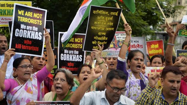 Supporters of the Gorkhaland movement chant slogans during the 38th day of an indefinite strike at Milanmore village in Darjeeling district on the outskirts of Siliguri on July 22,2017. (AFP) Supporters of the Gorkhaland movement chant slogans during the 38th day of an indefinite strike at Milanmore village in Darjeeling district on the outskirts of Siliguri on July 22,2017. (AFP)