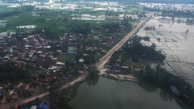 An aerial view shows a flood affected area near Janakpur around 300km south-east of Kathmandu. Three days of relentless downpours sparked flash floods and landslides that have killed at least 91 people in Nepal, 73 across northern and eastern India and 22 in Bangladesh. (Prakash Mathema / AFP)