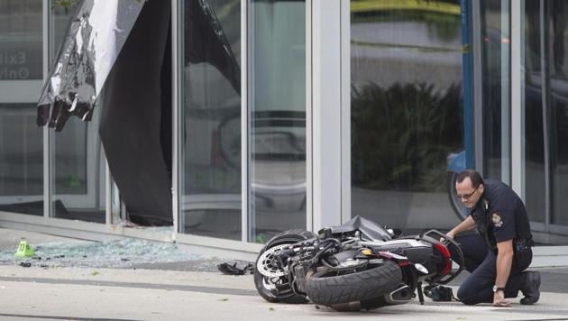 A police officer examines a motorcycle after a female stunt driver working on the movie Deadpool 2 died after a crash on set. (AP) A police officer examines a motorcycle after a female stunt driver working on the movie Deadpool 2 died after a crash on set. (AP)