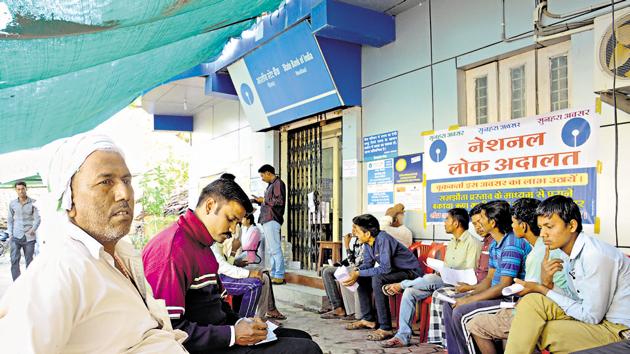 Villagers waiting outside a bank near Bhopal in November 2016. (Chandresh Mathur/ Hindustan Times) Villagers waiting outside a bank near Bhopal in November 2016. (Chandresh Mathur/ Hindustan Times)