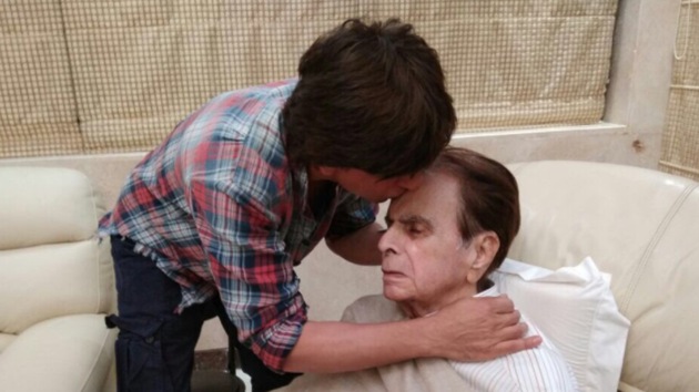 Shah Rukh Khan kisses Dilip Kumar on the forehead as he visits the veteran actor at home.
