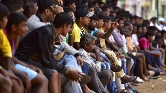 People from all walks of life gather during the Sunday matches of Independence Day Cup at Bengaluru East Stadium in Bengaluru. Independence Day Cup is a barefoot football tournament with a history of 61 years. (Arijit Sen/HT Photo) 