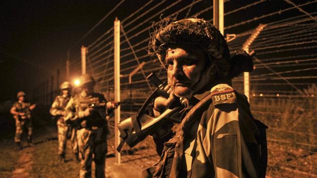 Border Security Force soldiers standing guard during a night patrol near the fence at the India-Pakistan International Border at the outpost of Akhnoor sector, on October 2, 2016. (HT File Photo) Border Security Force soldiers standing guard during a night patrol near the fence at the India-Pakistan International Border at the outpost of Akhnoor sector, on October 2, 2016. (HT File Photo)