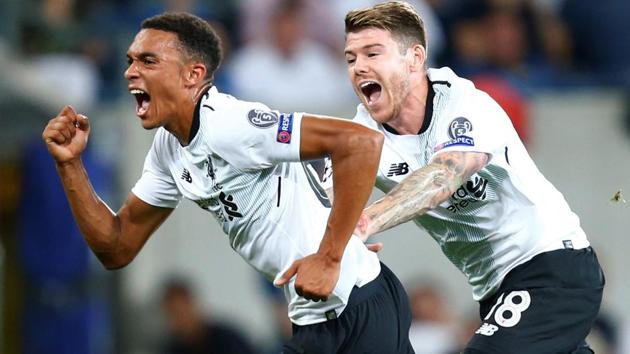 Liverpool's Trent Alexander-Arnold celebrates scoring their first goal against Hoffenheim in the UEFA Champions League qualifying playoff first leg in Sinsheim, Germany, on Tuesday. (Reuters) Liverpool's Trent Alexander-Arnold celebrates scoring their first goal against Hoffenheim in the UEFA Champions League qualifying playoff first leg in Sinsheim, Germany, on Tuesday. (Reuters)