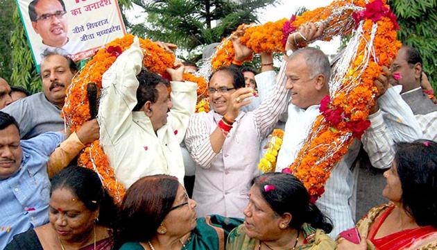 Madhya Pradesh chief minister Shivraj Singh Chouhan and state BJP chief Nandkumar Singh Chouhan celebrate with party workers in Bhopal after BJP clinched eight out of 10 civic bodies in the state. (PTI Photo) Madhya Pradesh chief minister Shivraj Singh Chouhan and state BJP chief Nandkumar Singh Chouhan celebrate with party workers in Bhopal after BJP clinched eight out of 10 civic bodies in the state. (PTI Photo)