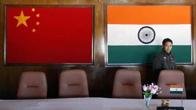 A man walks inside a conference room used for meetings between military commanders of China and India, at the Indian side of the Sino-India border at Bumla in Arunachal Pradesh on November 11, 2009.(Reuters File)