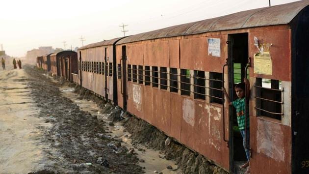 A Nepali child plays in an abandoned railway carriage of the Nepal Railway Corporation Ltd in Janakpur, some 300km south of Kathmandu on June 13.(AFP File Photo)