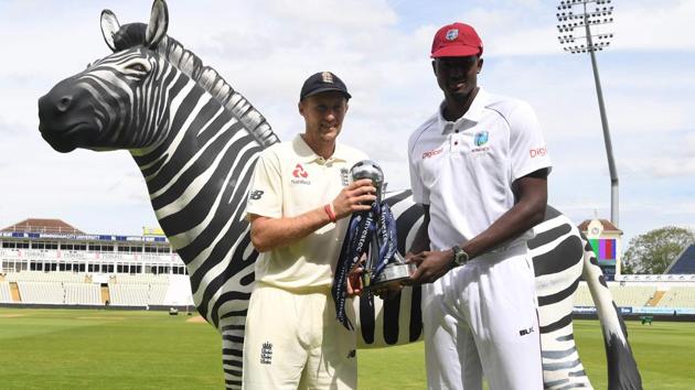 England caption Joe Root (L) and West Indies skipper Jason Holder pose for a picture with the series trophy on the eve of the first day of the first cricket Test Match between the two teams at Edgbaston in Birmingham. (AFP) England caption Joe Root (L) and West Indies skipper Jason Holder pose for a picture with the series trophy on the eve of the first day of the first cricket Test Match between the two teams at Edgbaston in Birmingham. (AFP)