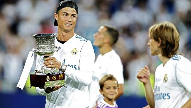Cristiano Ronaldo (L), suspended from the game, came into the field to join the celebrations. (AP)