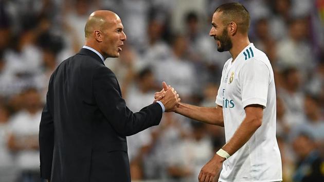 Real Madrid's French coach Zinedine Zidane (L) and Real Madrid's French forward Karim Benzema congratulate each other as they celebrate their Super Cup win vs FC Barcelona at the Santiago Bernabeu stadium in Madrid, on August 16, 2017. (AFP) Real Madrid's French coach Zinedine Zidane (L) and Real Madrid's French forward Karim Benzema congratulate each other as they celebrate their Super Cup win vs FC Barcelona at the Santiago Bernabeu stadium in Madrid, on August 16, 2017. (AFP)