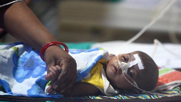 A file photo taken on August 14, 2017 shows a child at the encephalitis ward of the Baba Raghav Das Hospital in Gorakhpur, where 70 children died last week.(AFP)