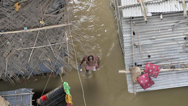 An Indian villager wades through flood waters near his submerged houses in Kishanganj village in Bihar state on August 16, 2017. (AFP Photo) An Indian villager wades through flood waters near his submerged houses in Kishanganj village in Bihar state on August 16, 2017. (AFP Photo)