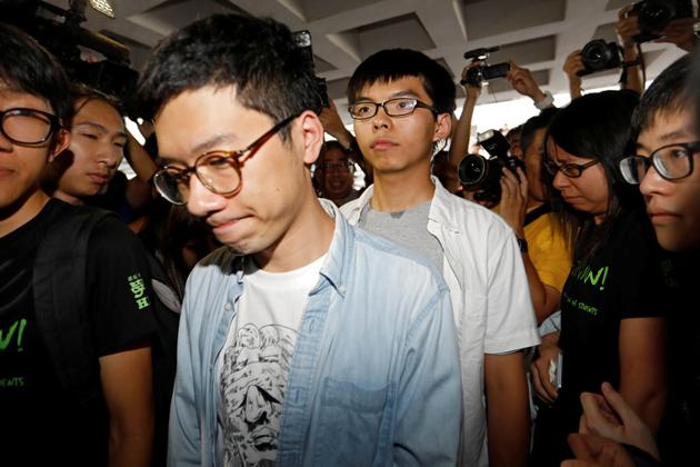 Student activists Nathan Law and Joshua Wong walk into the Hong Kong High Court on August 17, 2017. (Reuters) Student activists Nathan Law and Joshua Wong walk into the Hong Kong High Court on August 17, 2017. (Reuters)