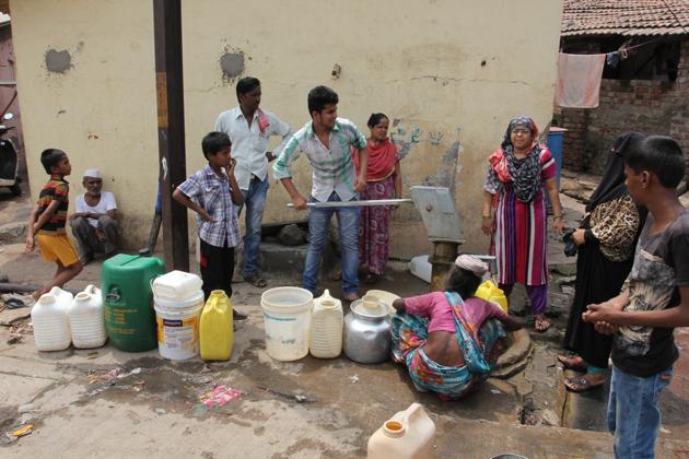 Residents wait for their turn to fill water at a handpump in Mumbra. (Representational photo/Praful Gangurde) Residents wait for their turn to fill water at a handpump in Mumbra. (Representational photo/Praful Gangurde)