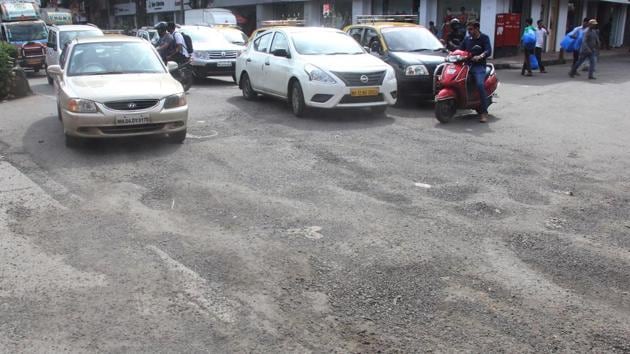 Potholes near Dadar flyover market in Mumbai. (Bhushan Koyande/HT) Potholes near Dadar flyover market in Mumbai. (Bhushan Koyande/HT)