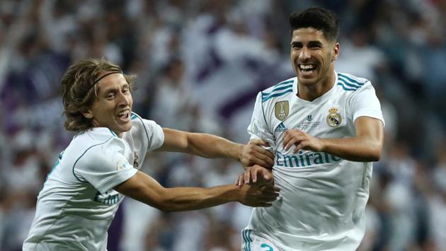 Marco Asensio (R) scored a stunning goal from long range to give Real Madrid a 1-0 lead on the night at Santiago Bernabeu, and 4-1 on aggregate, early in the game. (REUTERS)