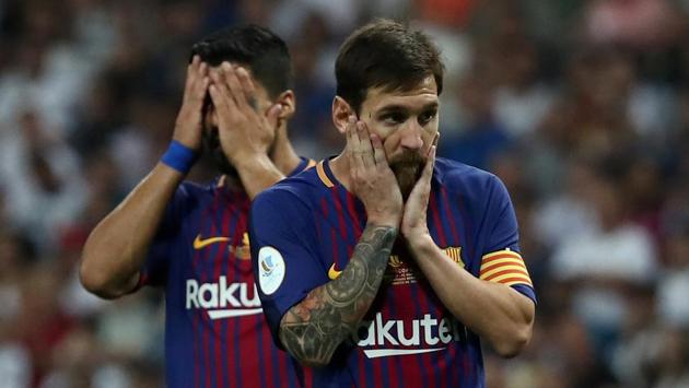 Lionel Messi (R) too cut a sorry figure as the Catalans struggled to break the European champions’ defence. (REUTERS)