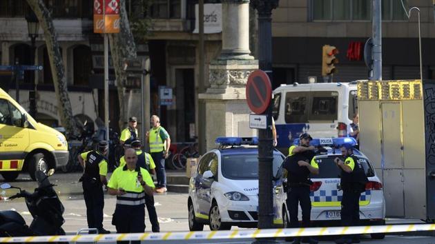 Medical staff members and policemen stand in a cordoned off area after a van ploughed into the crowd, injuring several persons on the Rambla in Barcelona on August 17, 2017. Police in Barcelona said they were dealing with a "terrorist attack" after a vehicle ploughed into a crowd of pedestrians on the city's famous Las Ramblas boulevard on August 17, 2017. (AFP Photo) Medical staff members and policemen stand in a cordoned off area after a van ploughed into the crowd, injuring several persons on the Rambla in Barcelona on August 17, 2017. Police in Barcelona said they were dealing with a "terrorist attack" after a vehicle ploughed into a crowd of pedestrians on the city's famous Las Ramblas boulevard on August 17, 2017. (AFP Photo)
