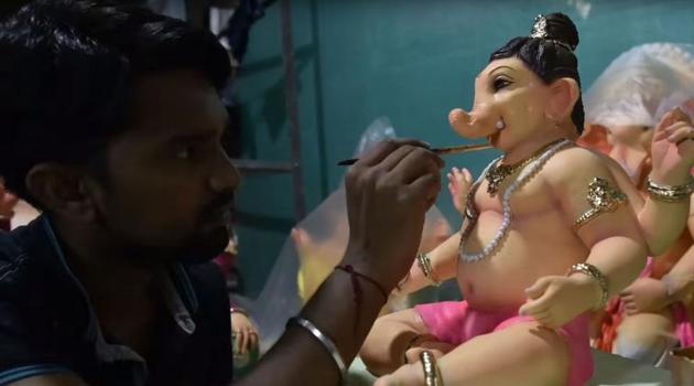A young artist at work at a Ganpati workshop in Parel.(HT)