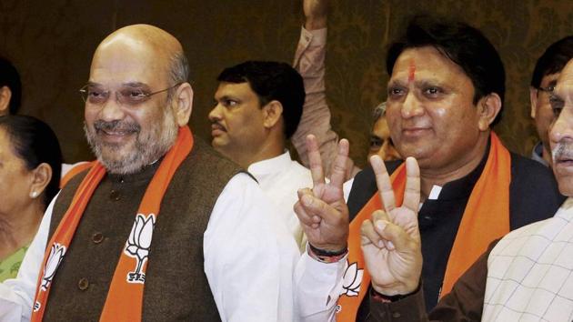 BJP president Amit Shah and party leader Balwantsinh Rajput (right) during a party meeting in Gandhinagar (PTI file photo) BJP president Amit Shah and party leader Balwantsinh Rajput (right) during a party meeting in Gandhinagar (PTI file photo)