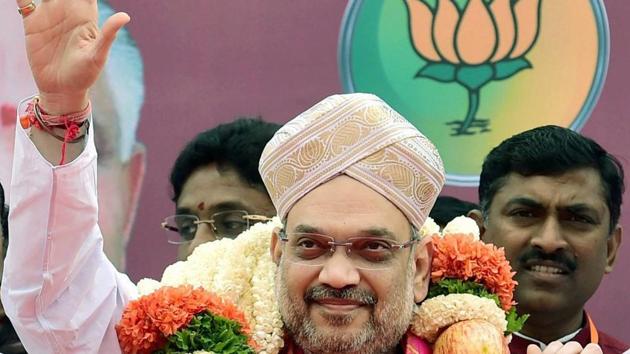 BJP president Amit Shah waves to his supporters upon his arrival on a three-day visit to Karnataka as part of his nationwide tour on Saturday. (PTI File Photo) BJP president Amit Shah waves to his supporters upon his arrival on a three-day visit to Karnataka as part of his nationwide tour on Saturday. (PTI File Photo)
