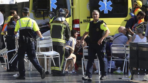 The late afternoon attack in the city’s Las Ramblas district left victims sprawled in the historic street, spattered with blood or writhing in pain from broken limbs. Others were ushered inside shops by officers with their guns drawn or fled in panic, screaming and carrying young children in their arms. (AP)