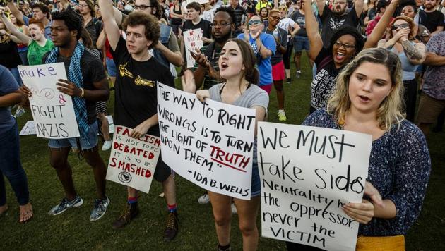 Demonstrators shout during a rally in Coolidge Park on Aug. 17, 2017, in Chattanooga, Tenn. Organizers said that the purpose of the demonstration, held in response to Saturday's rally by white nationalists in Charlottesville, Va., was to declare resistance against Nazism. (AP Photo) Demonstrators shout during a rally in Coolidge Park on Aug. 17, 2017, in Chattanooga, Tenn. Organizers said that the purpose of the demonstration, held in response to Saturday's rally by white nationalists in Charlottesville, Va., was to declare resistance against Nazism. (AP Photo)